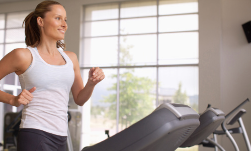 Woman Running on Treadmill